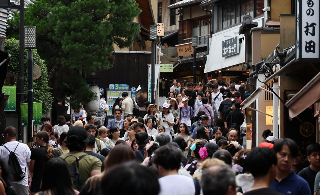 Visitors crowd a street leading to Kiyomizu Temple in Kyoto on Friday. Photo: Reuters