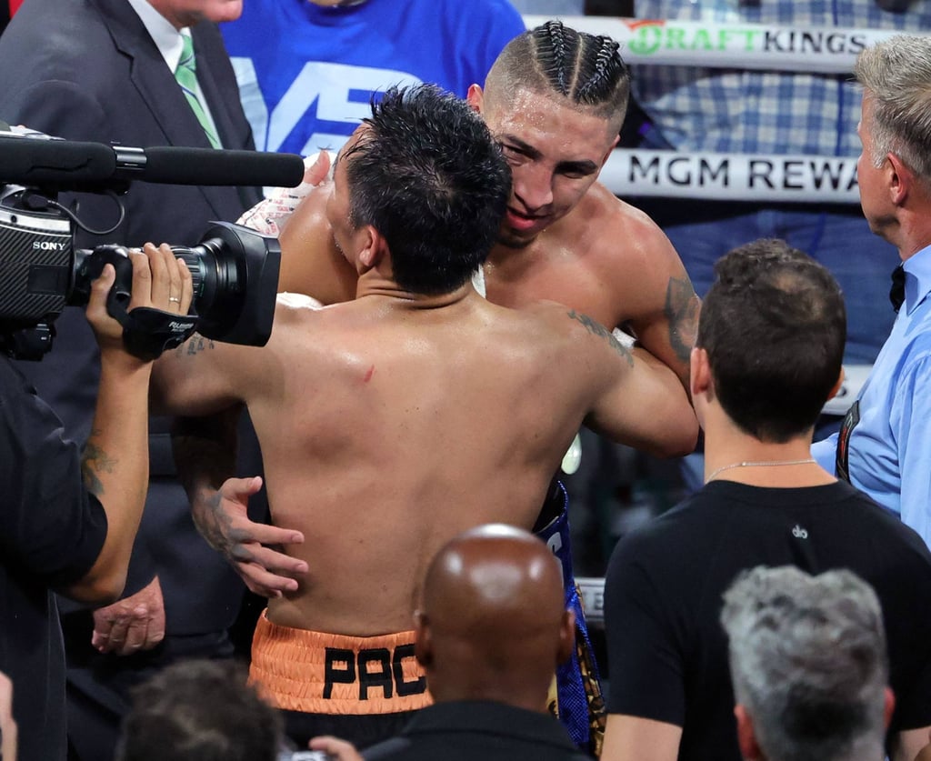 Manny Pacquiao and Mario Barrios (right) hug after their fight, which ended in a draw. Photo: AFP