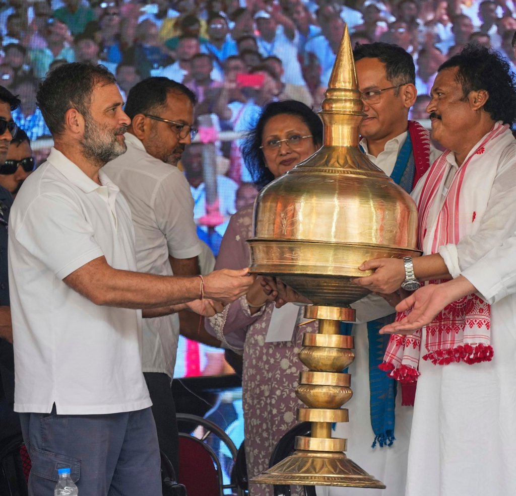 India’s opposition Congress party leader Rahul Gandhi (left) receives a giant Assamese traditional Sarai, a cultural symbol of the state, during a party worker’s meeting in Bangaon, west of Guwahati, on Wednesday. Photo: AP