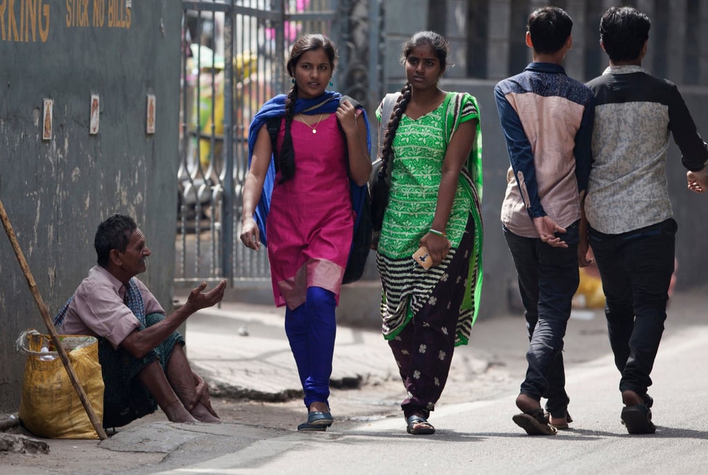 An Indian man seeks alms on a street in Hyderabad, India. Photo: AP An Indian man seeks alms on a street in Hyderabad, India. Photo: AP