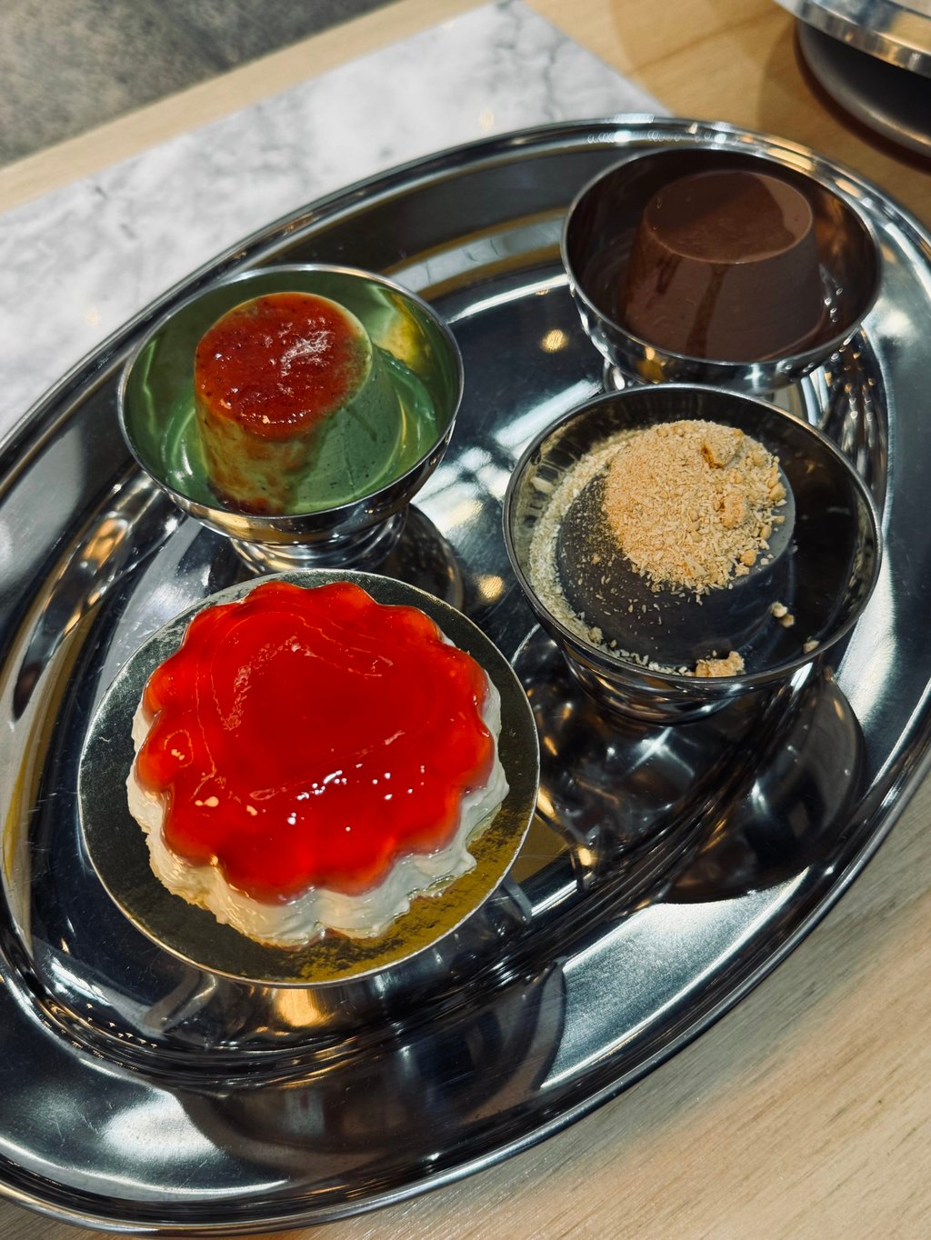 Various puddings by Joy Jaune, including Leung’s signature strawberry panna cotta (bottom left). Photo: Joy Jaune Various puddings by Joy Jaune, including Leung’s signature strawberry panna cotta (bottom left). Photo: Joy Jaune