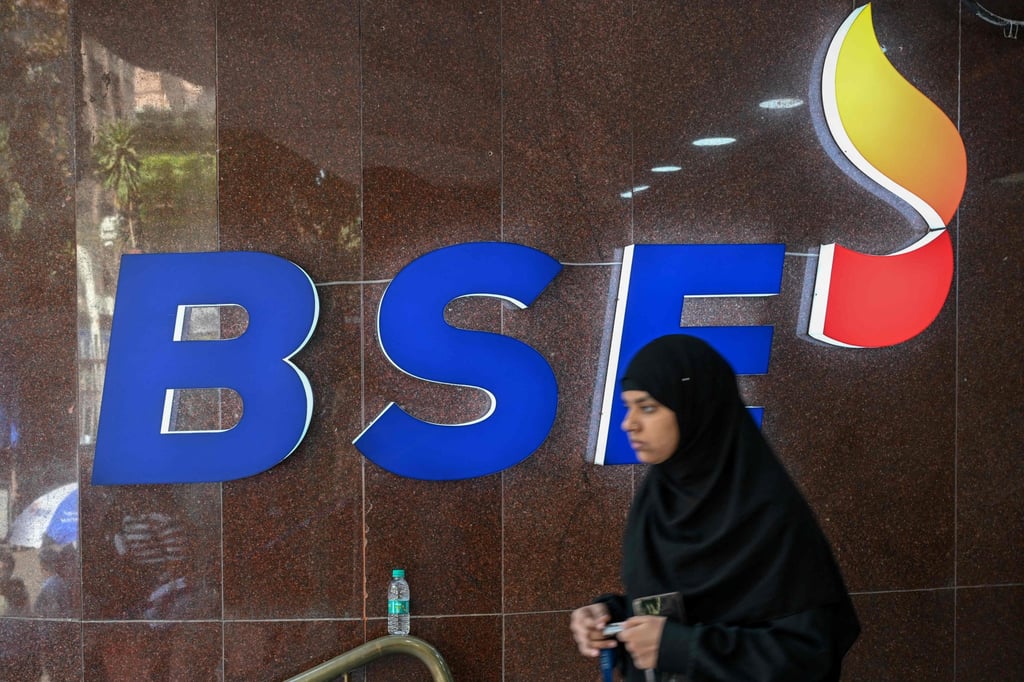 A woman walks past the logo of the Bombay Stock Exchange in Mumbai. Photo: AFP A woman walks past the logo of the Bombay Stock Exchange in Mumbai. Photo: AFP