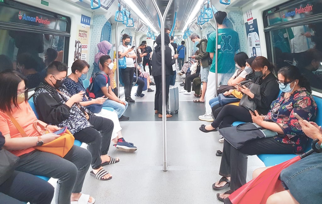 Commuters on Malaysia’s Rapid KL rail. Malaysians are wary of downloading MyDigital ID because of recent security breaches. Photo: Shutterstock