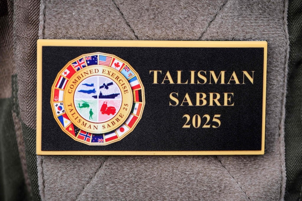 A French serviceman wears a badge displaying the emblem of the 2025 Talisman Sabre exercise aboard the French patrol vessel Auguste Benebig in Sydney on July 13. Photo: AFP A French serviceman wears a badge displaying the emblem of the 2025 Talisman Sabre exercise aboard the French patrol vessel Auguste Benebig in Sydney on July 13. Photo: AFP
