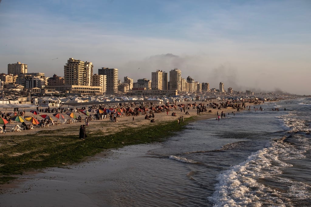 Palestinian families on the beach of Gaza City. Photo: EPA Palestinian families on the beach of Gaza City. Photo: EPA