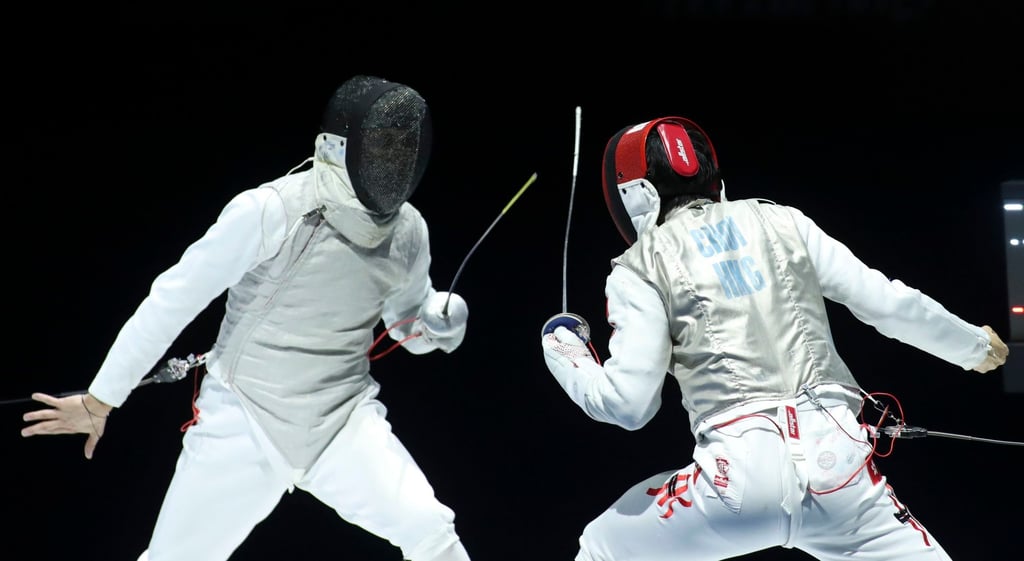 Ryan Choi (right) faces Kirill Borodachev in the foil final at the World Championships. Photo: EPA Ryan Choi (right) faces Kirill Borodachev in the foil final at the World Championships. Photo: EPA