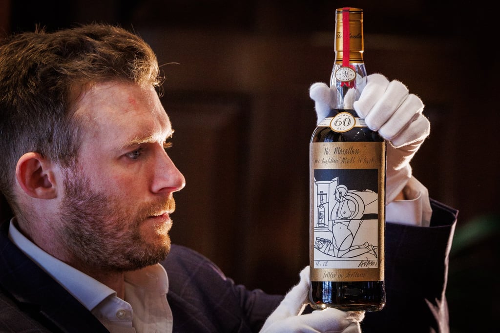 Jonny Fowle, Sotheby’s global head of spirits, holds a bottle of The Macallan 1926, the world’s most expensive whisky. Photo: Sotheby’s Jonny Fowle, Sotheby’s global head of spirits, holds a bottle of The Macallan 1926, the world’s most expensive whisky. Photo: Sotheby’s