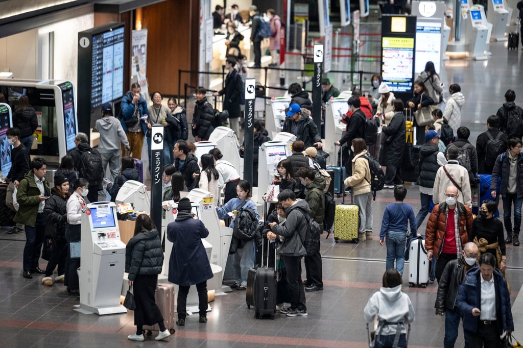 People wait to check in at the departure hall of Haneda Airport in Tokyo. A recent study has placed Japan well behind several developed economies in terms of international travel readiness. Photo: AFP People wait to check in at the departure hall of Haneda Airport in Tokyo. A recent study has placed Japan well behind several developed economies in terms of international travel readiness. Photo: AFP