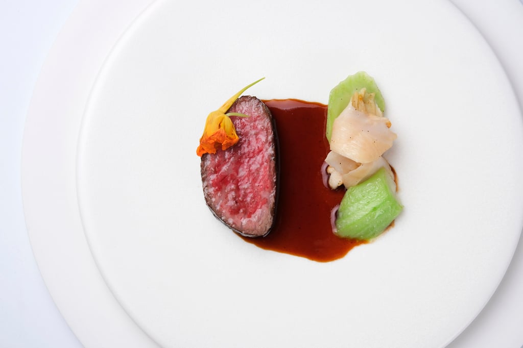 Mosu’s Hanwoo strip loin with geoduck and mustard-green stems. Photo: courtesy Mosu