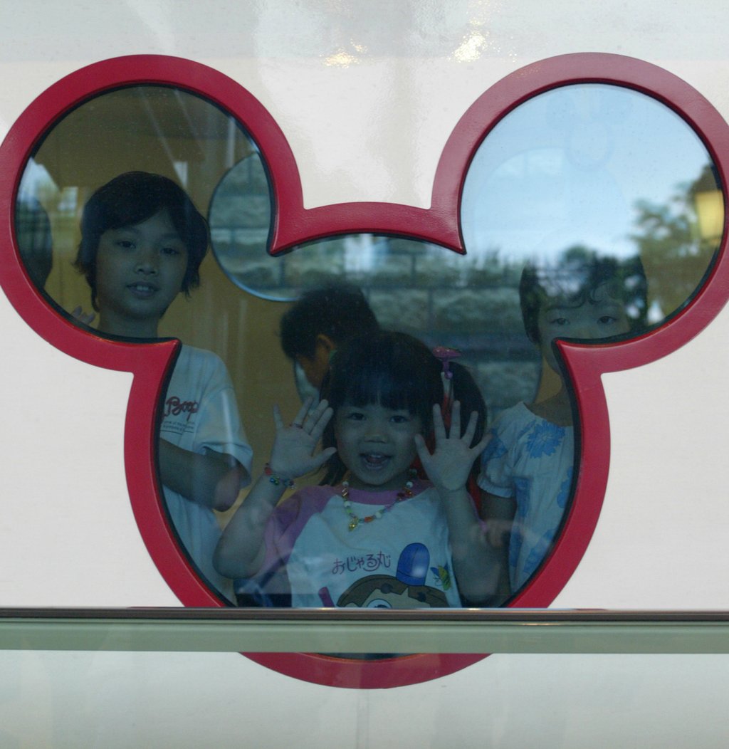 Children excitedly look through a Mickey Mouse-shaped window on a Disneyland Resort line train on August 1, 2005. Photo: Dustin Shum Children excitedly look through a Mickey Mouse-shaped window on a Disneyland Resort line train on August 1, 2005. Photo: Dustin Shum