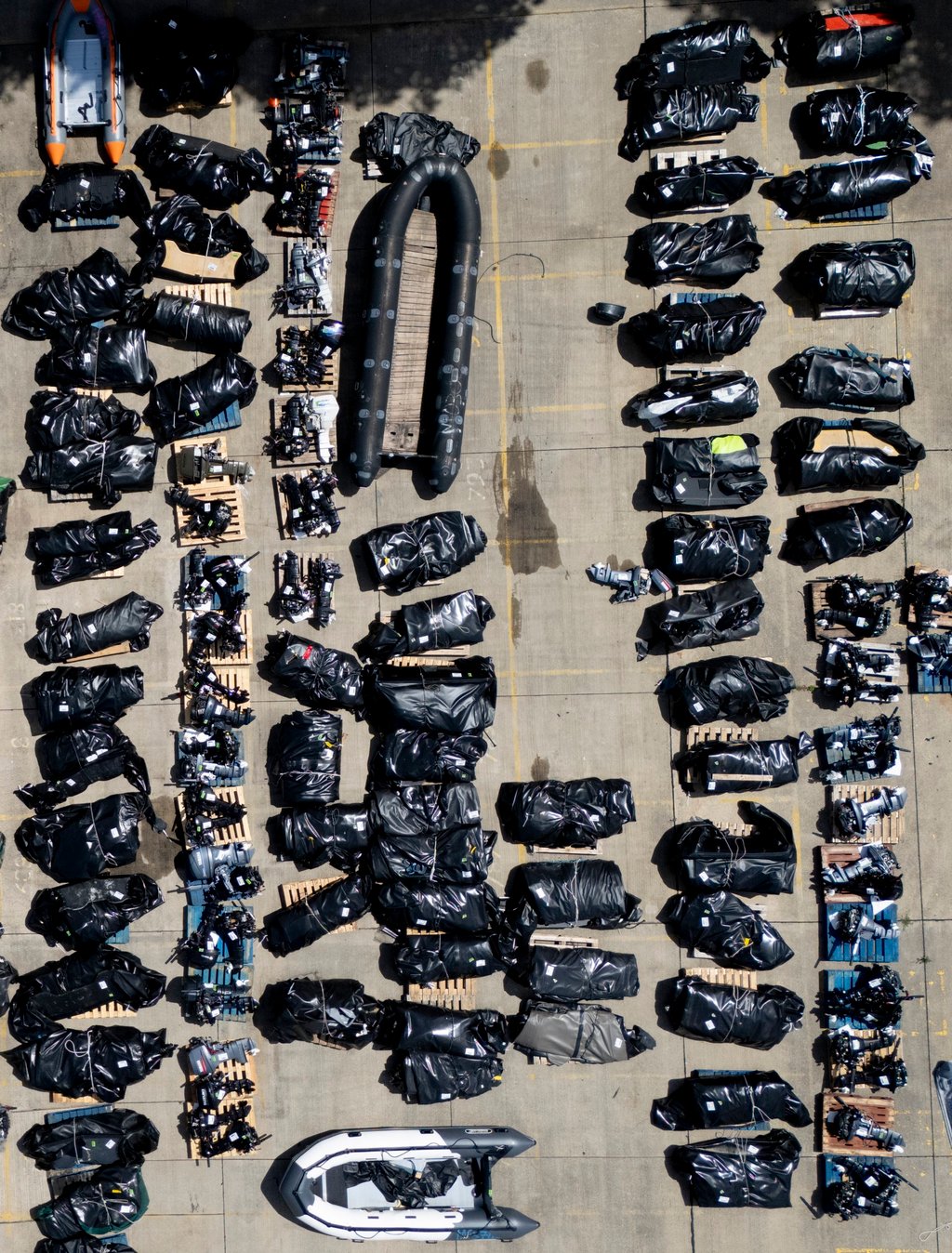A picture taken with a drone shows small boats, used by migrants crossing the English Channel, stored at a UK Home Office facility in Dover on July 17. Photo: EPA A picture taken with a drone shows small boats, used by migrants crossing the English Channel, stored at a UK Home Office facility in Dover on July 17. Photo: EPA