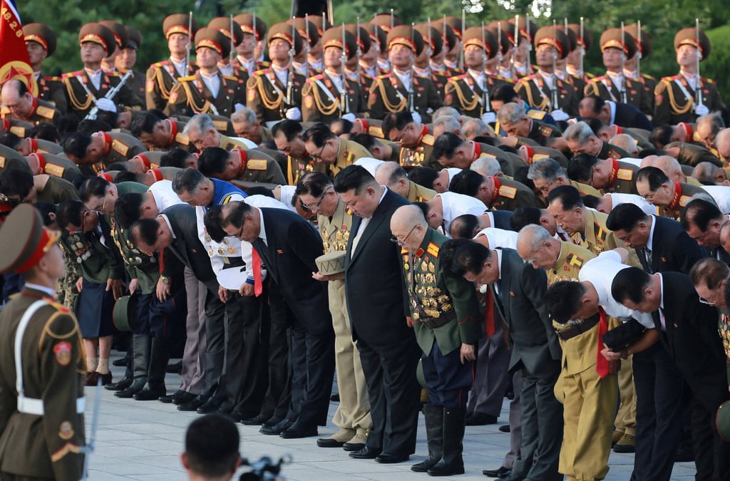North Korean leader Kim Jong-un (centre) pays respect to fallen soldiers at the Fatherland Liberation War Martyrs’ Cemetery in Pyongyang in a photo released on Sunday. Photo: KCNA/Reuters North Korean leader Kim Jong-un (centre) pays respect to fallen soldiers at the Fatherland Liberation War Martyrs’ Cemetery in Pyongyang in a photo released on Sunday. Photo: KCNA/Reuters