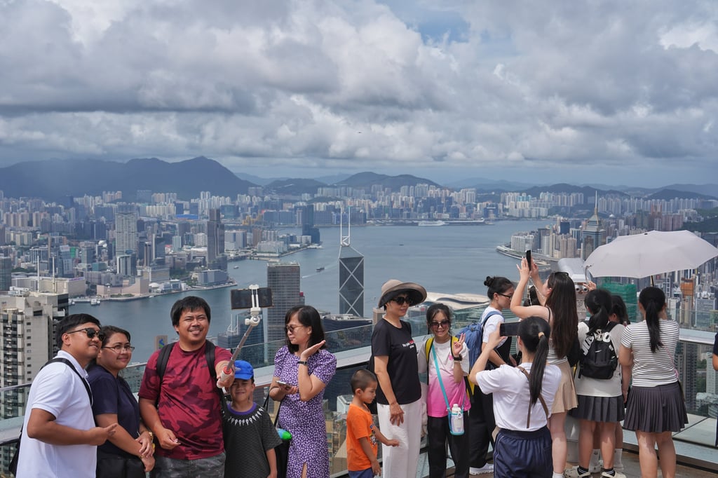 Tourists at the Observation Deck of the Peak Tower. Photo: Elson Li Tourists at the Observation Deck of the Peak Tower. Photo: Elson Li