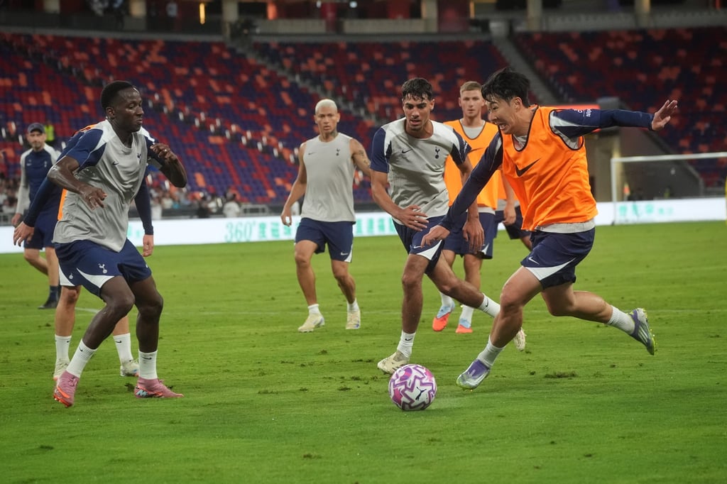 Son Heung-min powers forwards as the Kai Tak playing surface shows signs of wear and tear. Photo: Elson Li