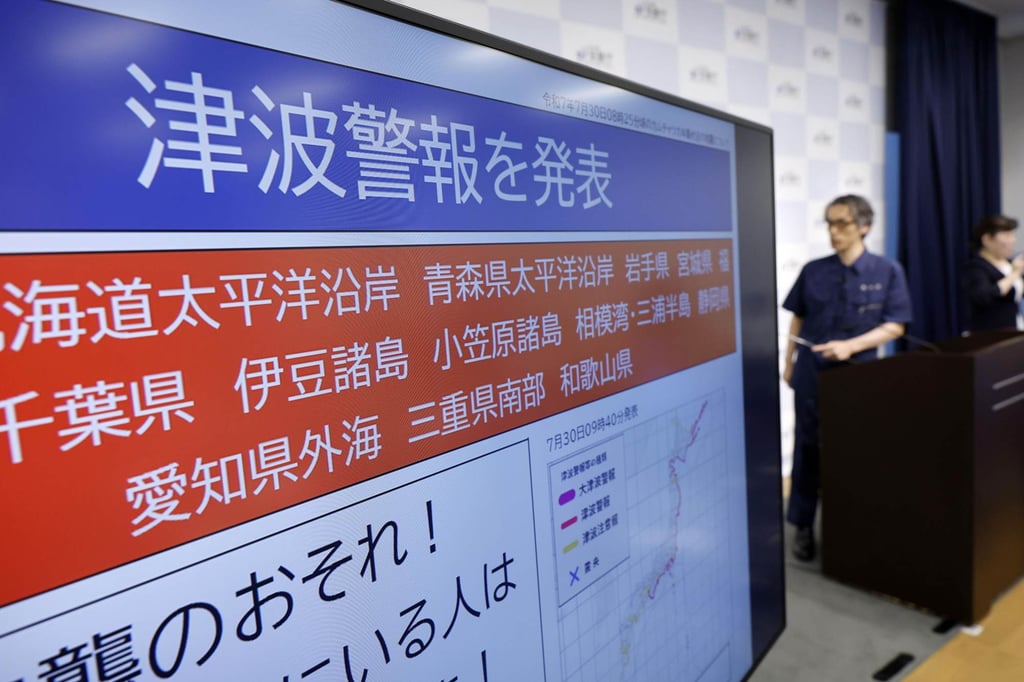 A Japan Meteorological Agency tsunami warning displayed at a press conference in Tokyo on Wednesday, following a powerful earthquake off Russia’s Kamchatka peninsula. Photo: Kyodo A Japan Meteorological Agency tsunami warning displayed at a press conference in Tokyo on Wednesday, following a powerful earthquake off Russia’s Kamchatka peninsula. Photo: Kyodo