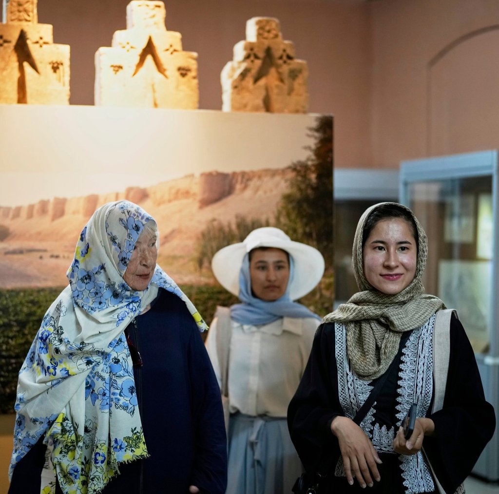 Afghan tour guide Somaya Moniry, (right) and Maryam, a local trainee tour guide (centre) accompany Australian tourist Suzanne Sandral, left, during a visit to the National Museum in Kabul, Afghanistan, on May 28. Photo: AP