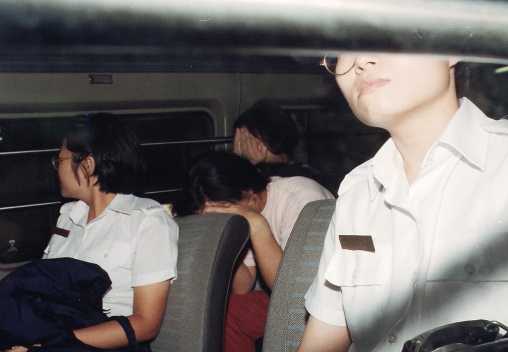 Co-defendant Phoebe Wong Yim-ping (Centre, in front) in custody following her sentencing at the Hong Kong High Court. Photo: SCMP Archives