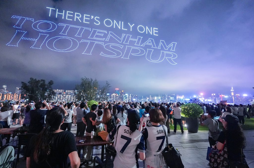 Crowds enjoy a Tottenham-themed drone show over Hong Kong’s harbour on Wednesday. Photo: Eugene Lee Crowds enjoy a Tottenham-themed drone show over Hong Kong’s harbour on Wednesday. Photo: Eugene Lee