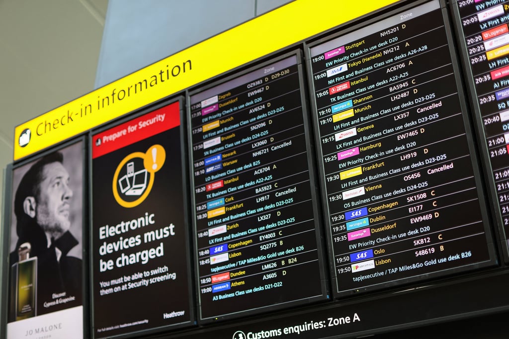 A check-in information board displays details on cancelled flights at Heathrow Airport in Hounslow, London on Wednesday. Photo: Reuters