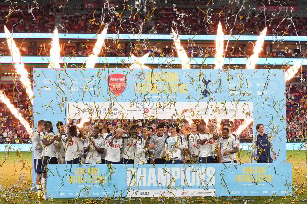 Tottenham players celebrate beating Arsenal in the Herbalgy Trophy at Kai Tak Stadium. Photo: Sam Tsang Tottenham players celebrate beating Arsenal in the Herbalgy Trophy at Kai Tak Stadium. Photo: Sam Tsang