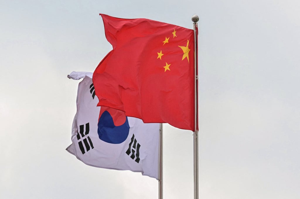 The national flags of South Korea and China flutter in the wind before the arrival of Chinese Premier Li Qiang in Seoul last year. Photo: AFP The national flags of South Korea and China flutter in the wind before the arrival of Chinese Premier Li Qiang in Seoul last year. Photo: AFP