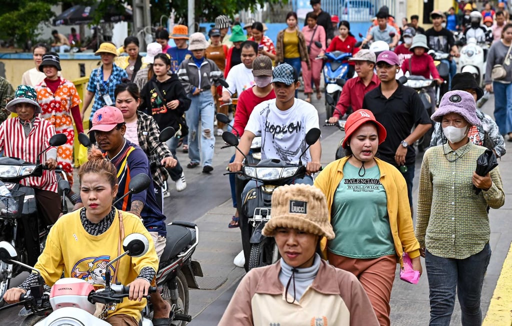 Garment workers walk out of their factory during their lunch break in Phnom Penh. Prime Minister Hun Manet has hailed the 19 per cent tariff deal as “the best news for the people and economy of Cambodia”. Photo: AFP