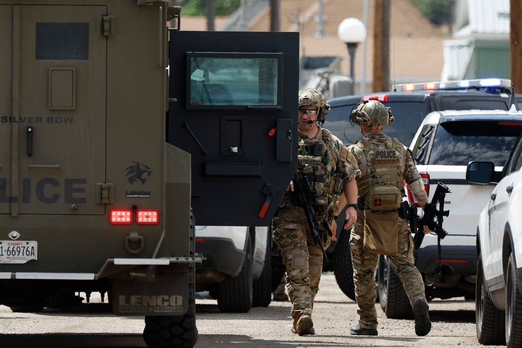 Law enforcement personnel respond to a shooting in Anaconda, Montana, on Friday. Photo: The Montana Standard via AP Law enforcement personnel respond to a shooting in Anaconda, Montana, on Friday. Photo: The Montana Standard via AP