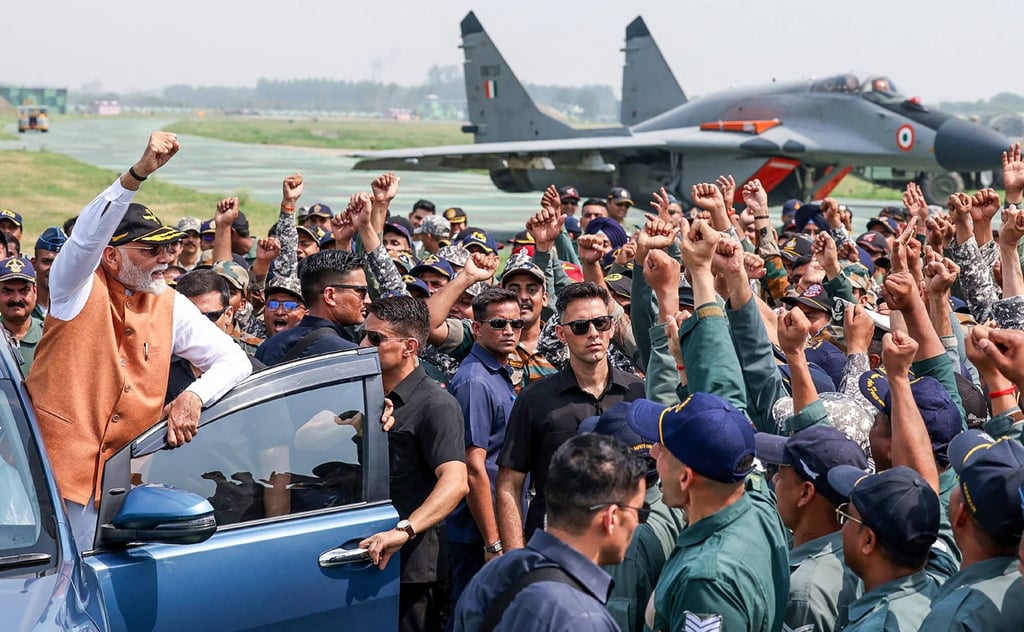 India’s Prime Minister Narendra Modi (left) visits the Adampur Airforce Base in India’s state of Punjab in a photograph released on May 13. Photo: Indian Press Information Bureau/AFP)