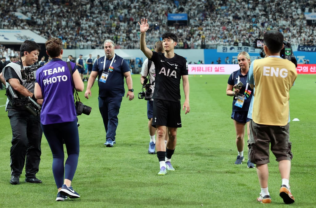 Son Heung-min acknowledges fans at the Seoul World Cup Stadium on Sunday. Photo: Reuters