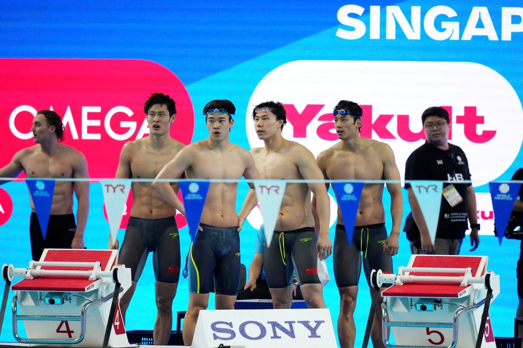 China’s quartet look downcast after their 4x100m medley relay heat on Sunday. Photo: AP