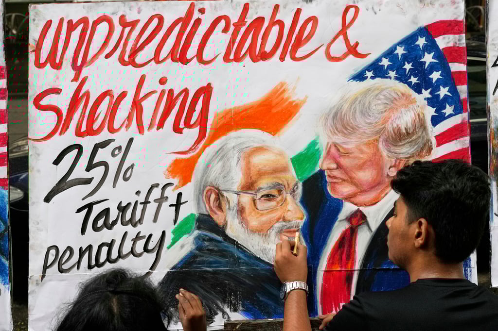 An art student completes an artwork depicting US President Donald Trump and Indian Prime Minister Narendra Modi, and referencing Washington’s tariffs, in Mumbai on Friday. Photo: AP