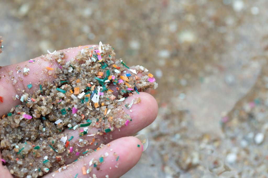 Microplastic waste is seen among sand at a beach. Photo: Shutterstock Microplastic waste is seen among sand at a beach. Photo: Shutterstock