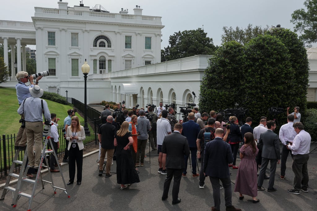 Reporters gather on the West Wing driveway as they wait for US President Donald Trump to appear on the roof of the White House on Tuesday. Photo: Reuters Reporters gather on the West Wing driveway as they wait for US President Donald Trump to appear on the roof of the White House on Tuesday. Photo: Reuters