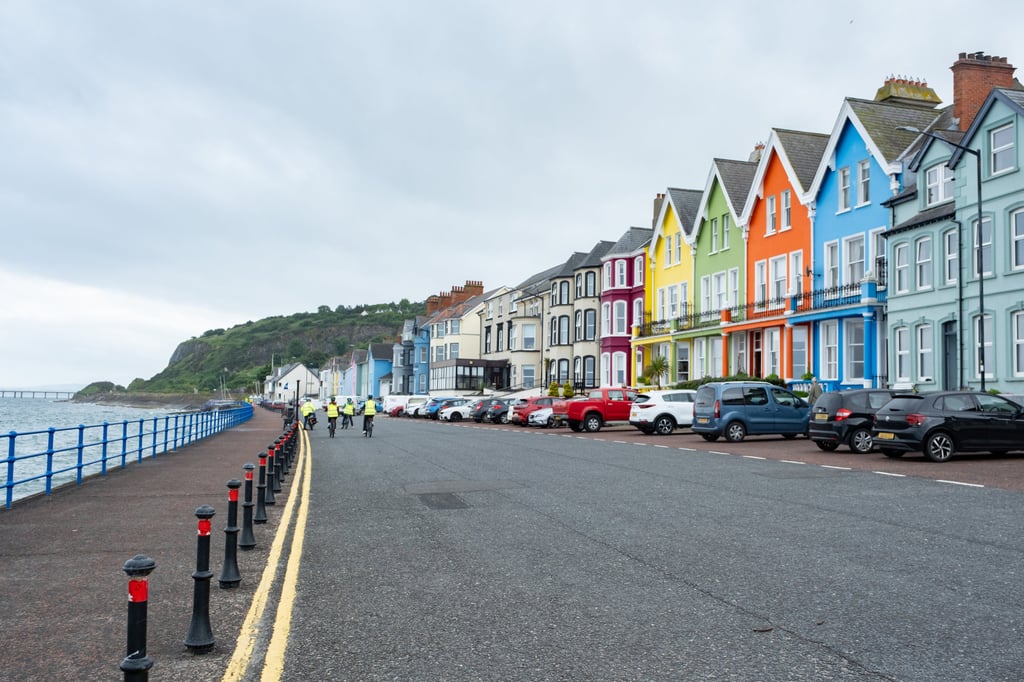 A row of multicoloured houses in Whitehead, a seaside town along Northern Ireland’s Causeway Coastal Route. Photo: PA/dpa