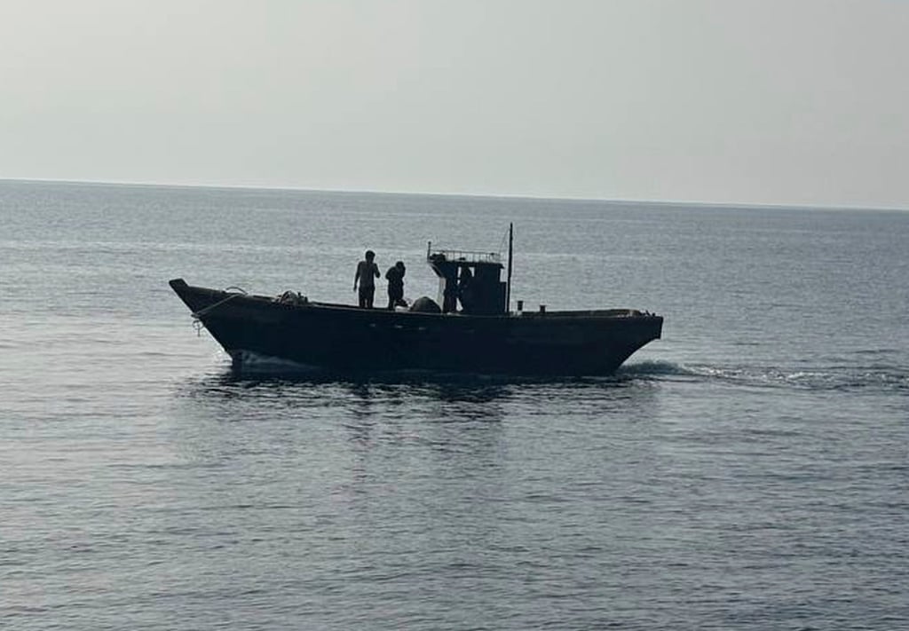 A wooden boat carrying North Koreans are sent back across the sea border with South Korea in the East Sea on July 9. South Korea Unification Ministry/AP