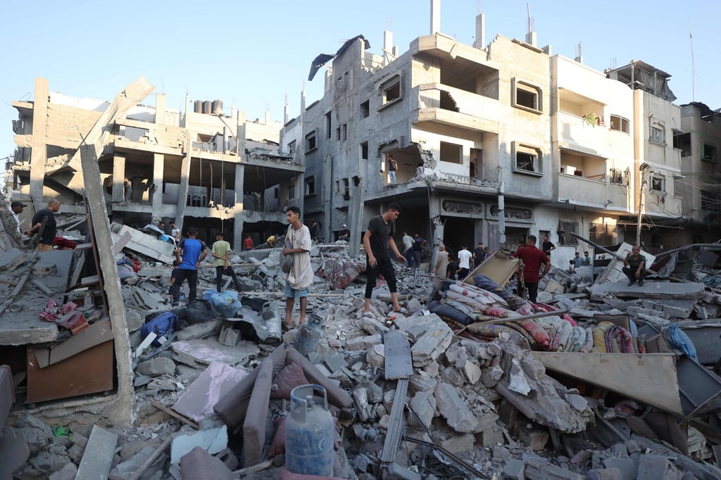 Palestinians inspect the rubble after an Israeli strike on the Bureij refugee camp in the central Gaza Strip on July 23. Photo: AFP Palestinians inspect the rubble after an Israeli strike on the Bureij refugee camp in the central Gaza Strip on July 23. Photo: AFP