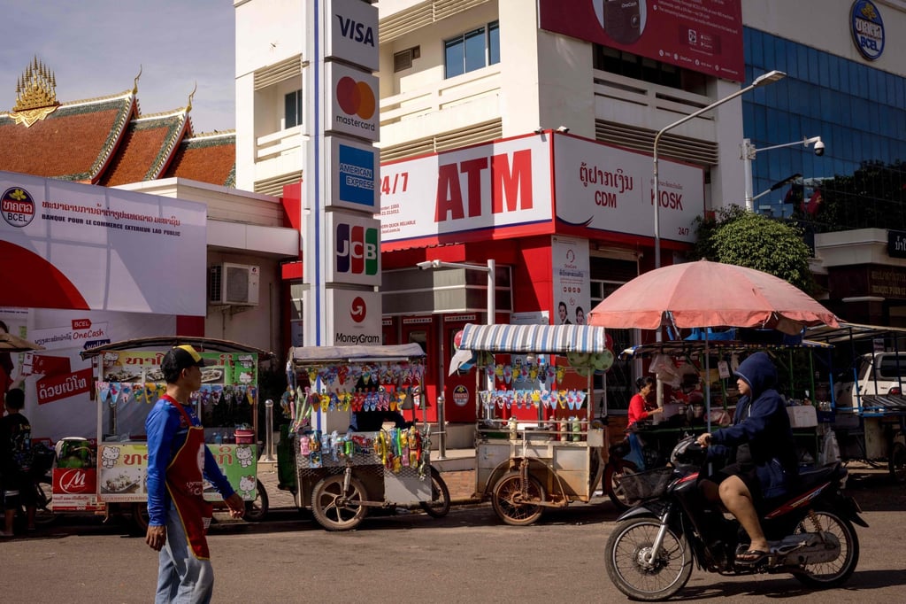 Vendors sell their wares in Vientiane. Landlocked Laos, a country of only 8 million, has been hit with a 40 per cent tariff by the US. Photo: AFP