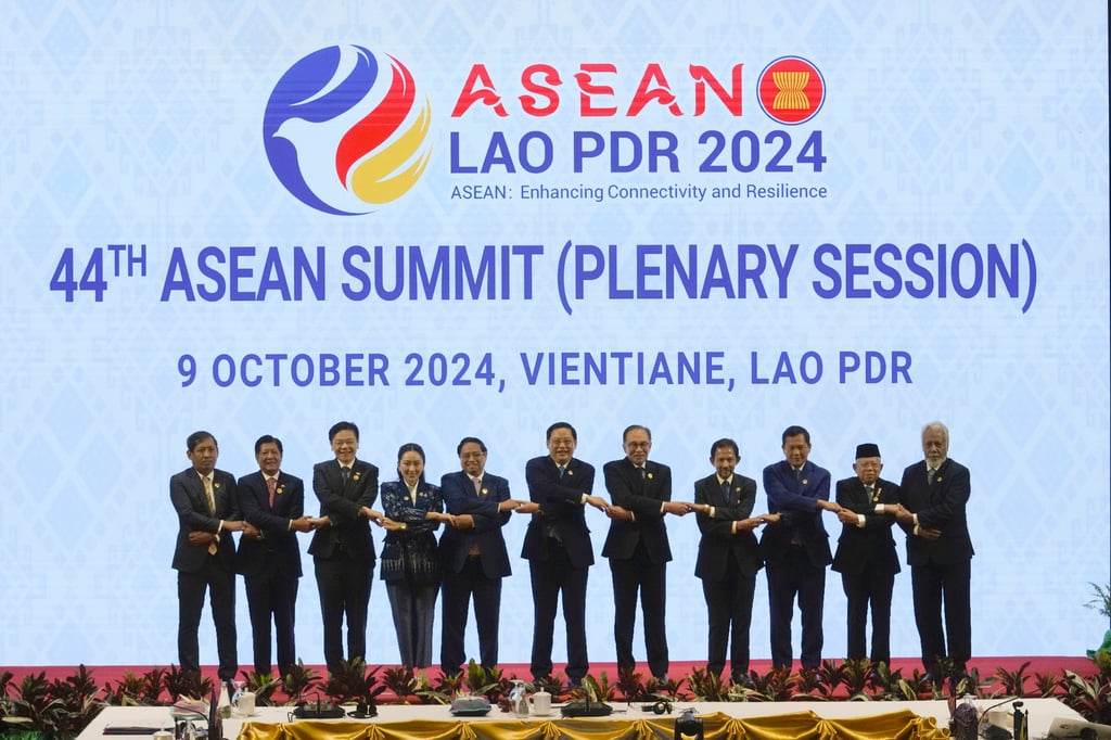Southeast Asian leaders hold hands during the opening ceremony of the Asean summit in Vientiane, Laos, on October 9, 2024. This year’s summit will take place in October in Kuala Lumpur. Photo: AP