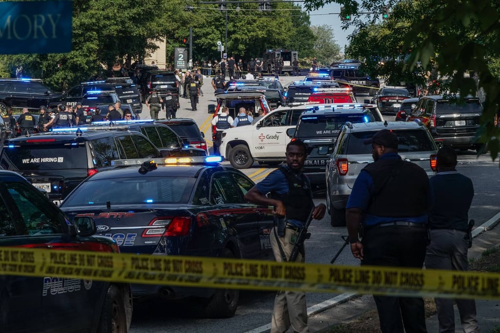Law enforcement personnel and vehicles are seen near the Centres For Disease Control (CDC) Global Headquarters during an active shooter incident in Atlanta, Georgia, on Friday. Photo: AFP
