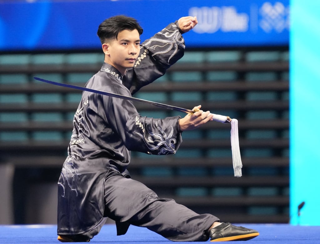 Anthony Yeung performing in the taijiquan-taijijian wushu final on Saturday. Photo: Xinhua Anthony Yeung performing in the taijiquan-taijijian wushu final on Saturday. Photo: Xinhua