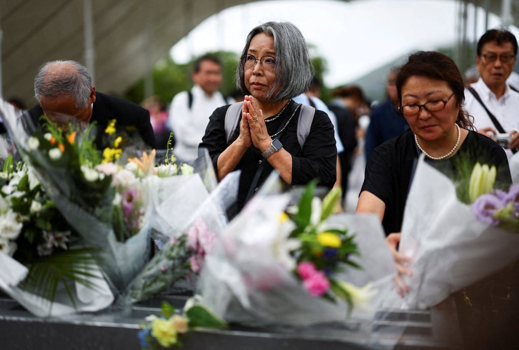 Attendees pray for the victims on the day of a ceremony commemorating the 80th anniversary of the bombing of the city, at the Peace Park in Nagasaki, southwestern Japan, on Saturday. Photo: Reuters Attendees pray for the victims on the day of a ceremony commemorating the 80th anniversary of the bombing of the city, at the Peace Park in Nagasaki, southwestern Japan, on Saturday. Photo: Reuters