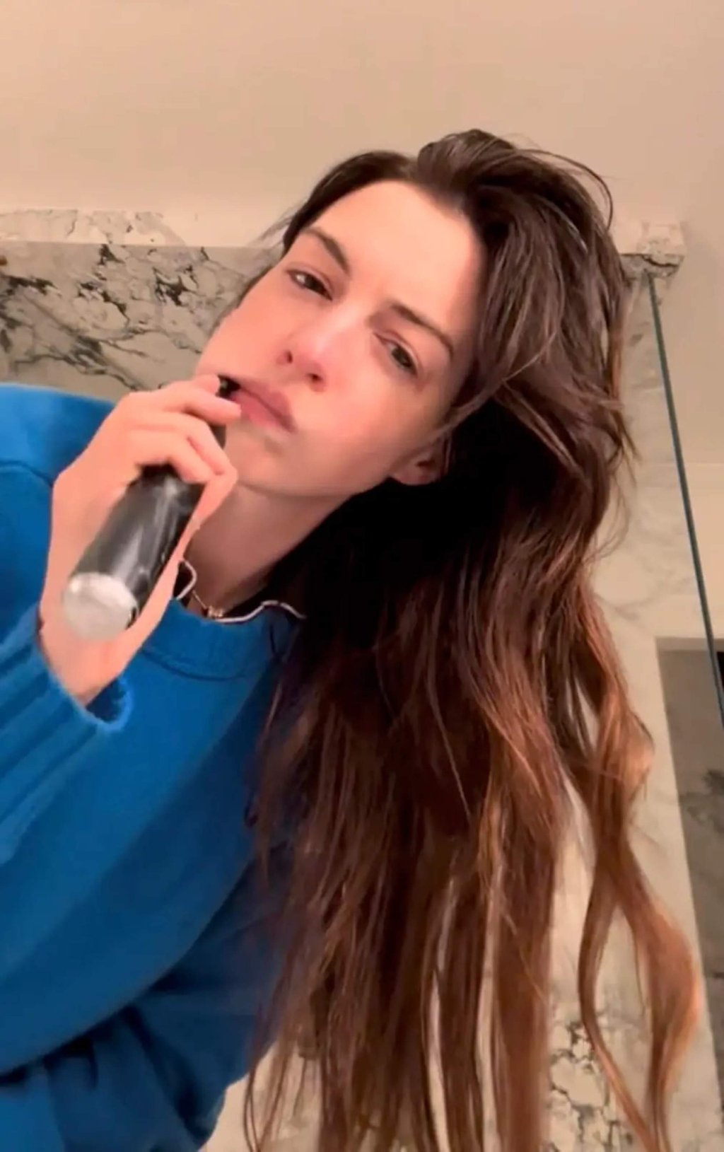 Anne Hathaway posted a photo of herself in a “cerulean blue” jumper on TikTok with the caption: “Heading to werk #dwp2”. Photo: Anne Hathaway/TikTok