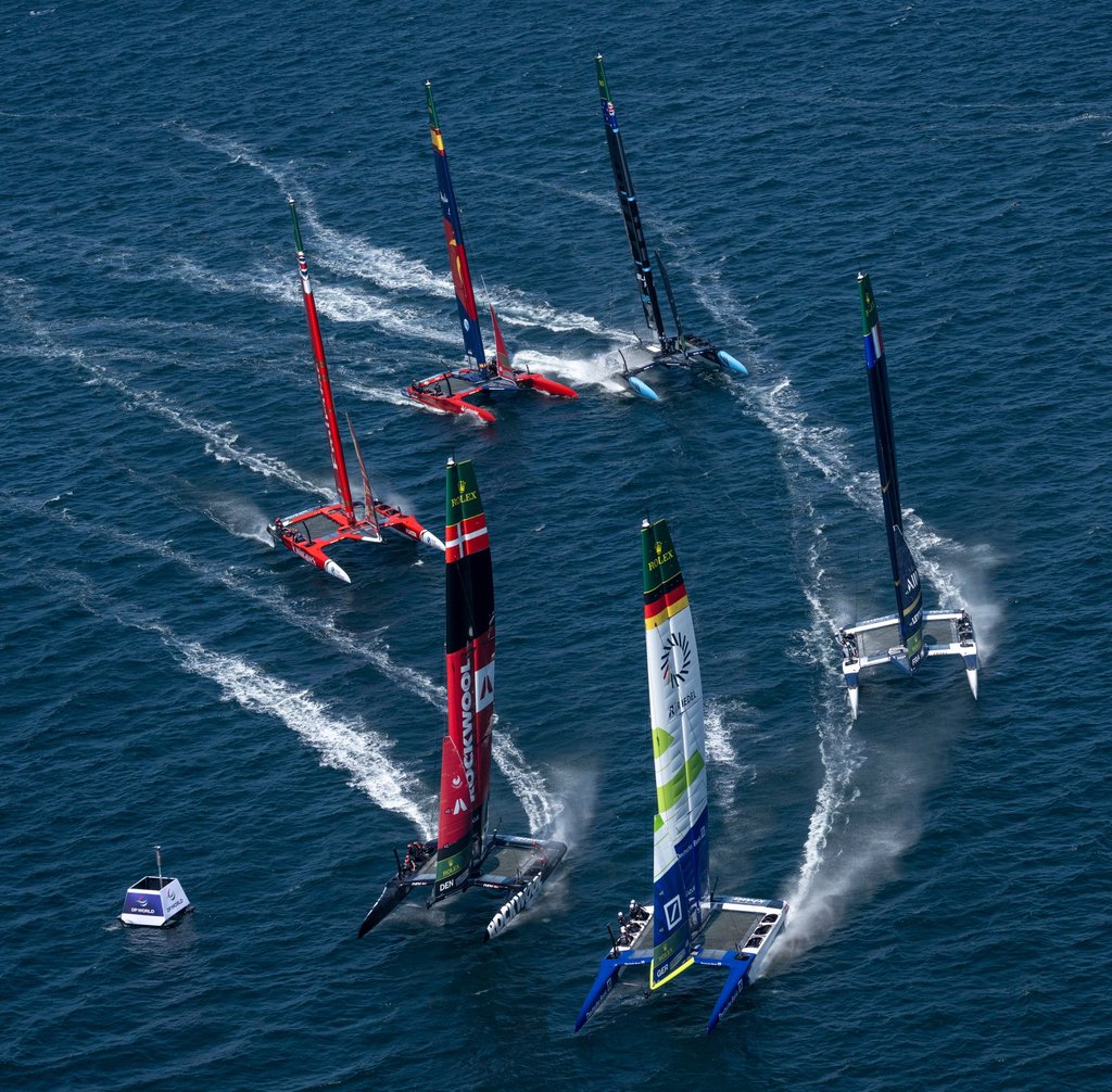 The Germany SailGP team rounds the mark marginally ahead of Denmark SailGP, with the French, British, New Zealand and Spanish teams in pursuit during a practice session ahead of the KPMG Australia Sail Grand Prix in Sydney, in February. Photo: Handout
