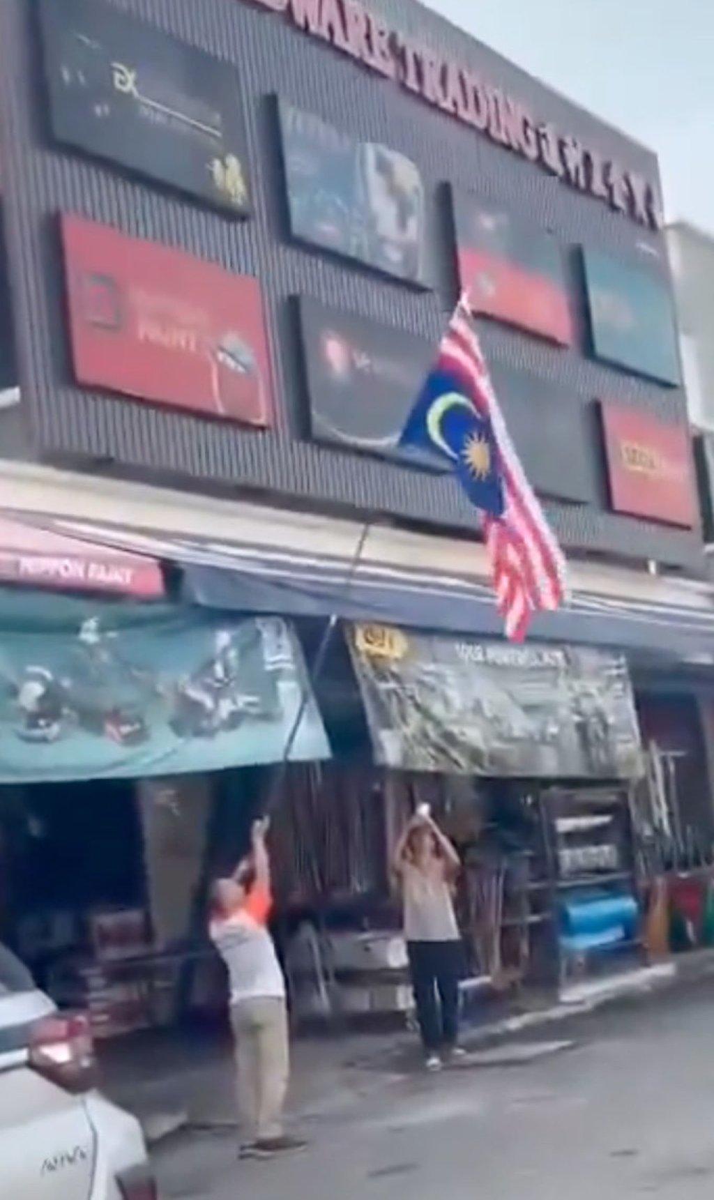 An ethnic Chinese trader accidentally hoists the national flag upside down in front of his hardware shop in Penang on Saturday. Photo: Handout An ethnic Chinese trader accidentally hoists the national flag upside down in front of his hardware shop in Penang on Saturday. Photo: Handout