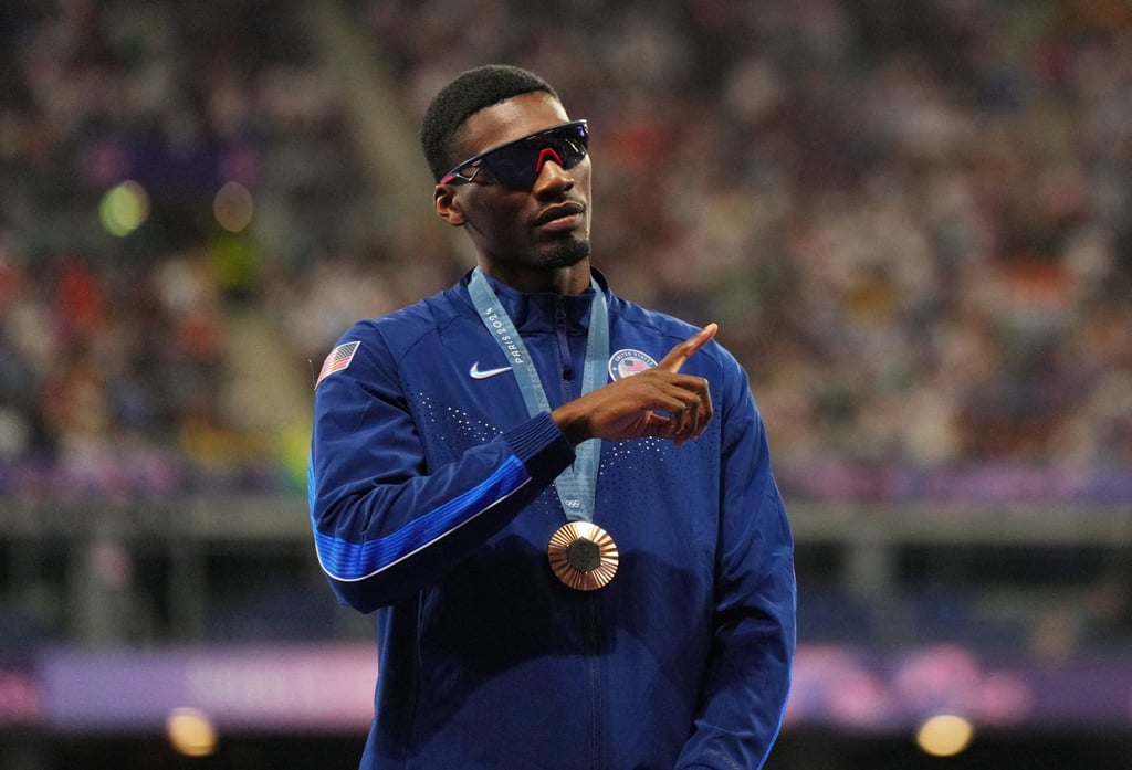 Bronze medallist Fred Kerley during the 100m victory ceremony at the Paris Games. Photo: Reuters