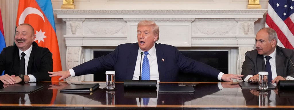 US President Donald Trump (centre) is flanked by Armenian Prime Minister Nikol Pashinyan (right) and Azerbaijan President Ilham Aliyev at the peace signing ceremony in the White House on Friday. Photo: AP