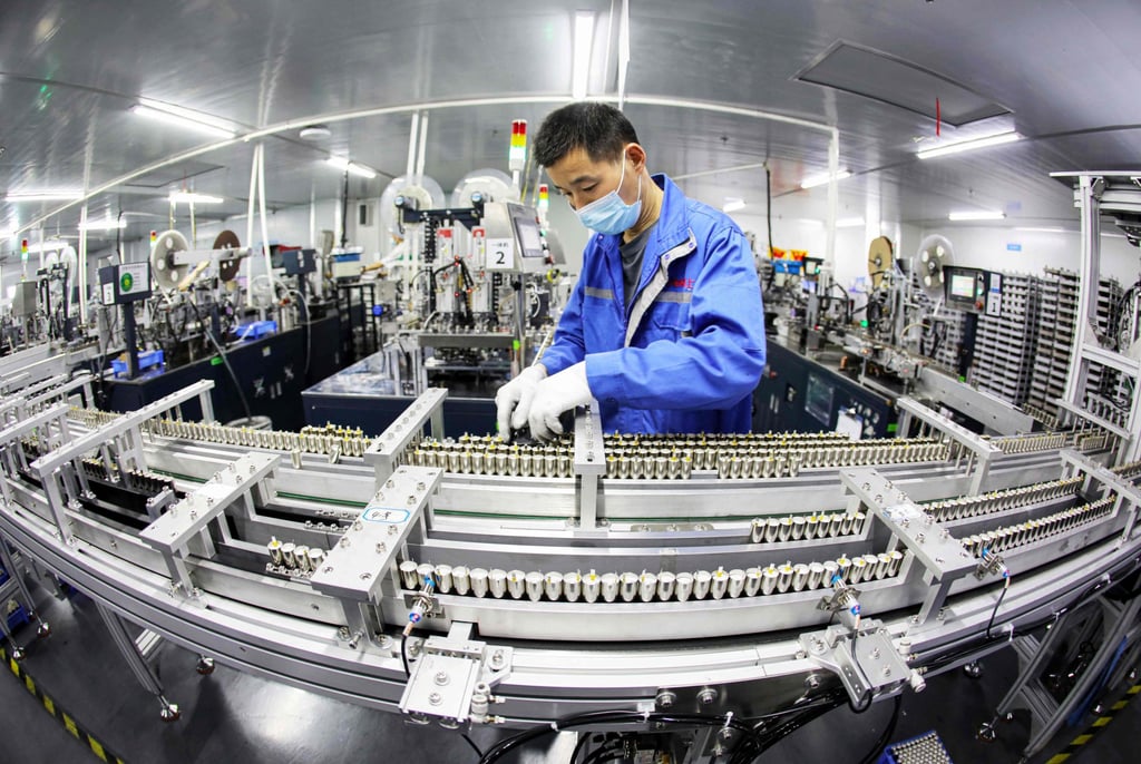 An employee works on a lithium battery production line at a factory in Huaibei, Anhui province, China, in April. Photo: AFP An employee works on a lithium battery production line at a factory in Huaibei, Anhui province, China, in April. Photo: AFP