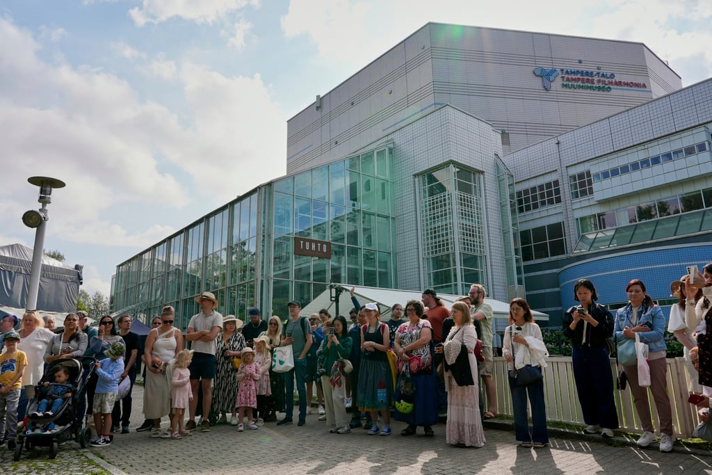 Moomins fans congregate outside the Tampere Hall, which houses the Moomins Museum, to celebrate the anniversary. Photo: AP Moomins fans congregate outside the Tampere Hall, which houses the Moomins Museum, to celebrate the anniversary. Photo: AP