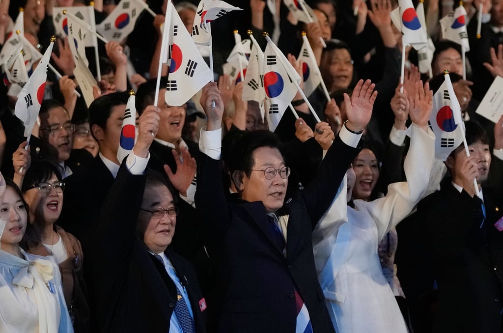 South Korean President Lee Jae-myung (front, centre) waves the national flag during a ceremony celebrating the 80th anniversary of Korea’s liberation from Japanese colonial rule in Seoul on Friday. Photo: EPA