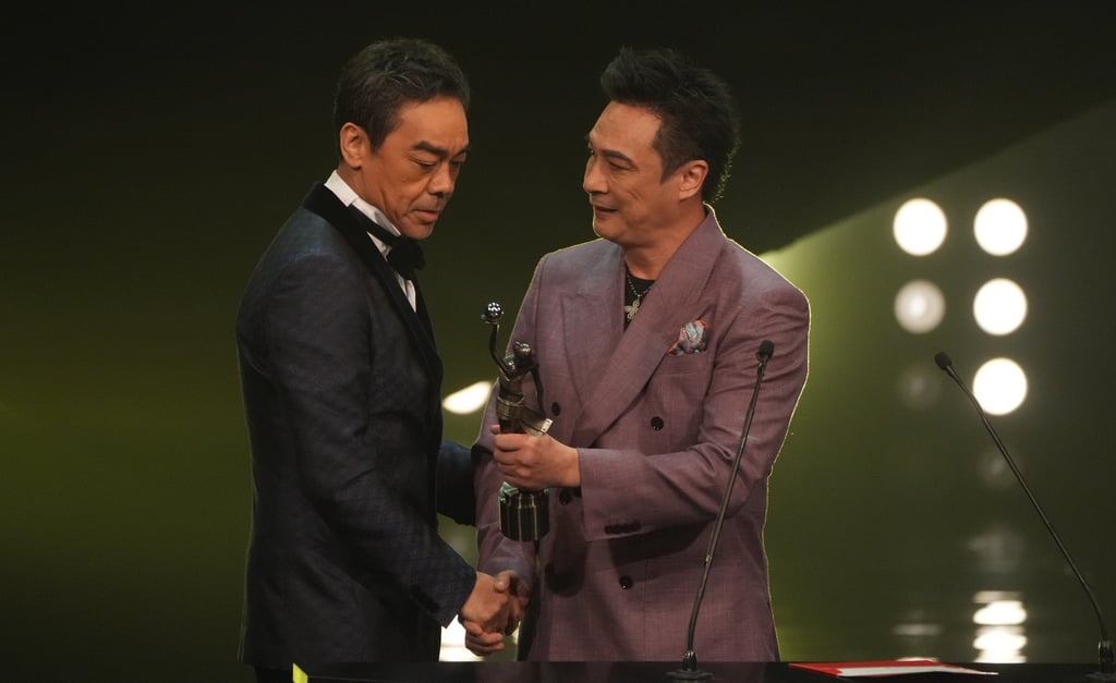 Francis Ng (right) presents Lau Ching-wan with the best actor statue at the 41st Hong Kong Film Awards ceremony in April 2023. Photo: SCMP